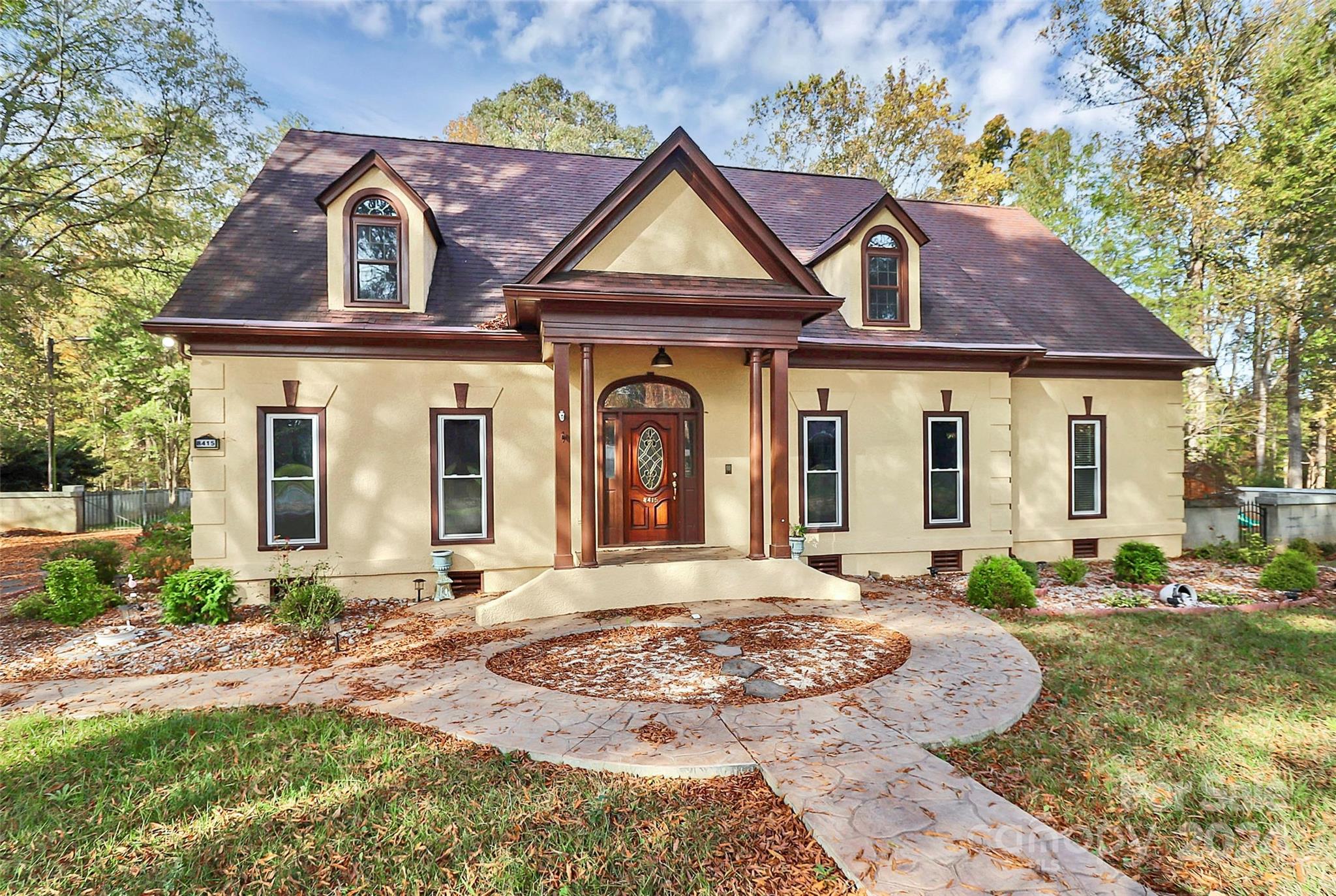 a front view of a house with a yard