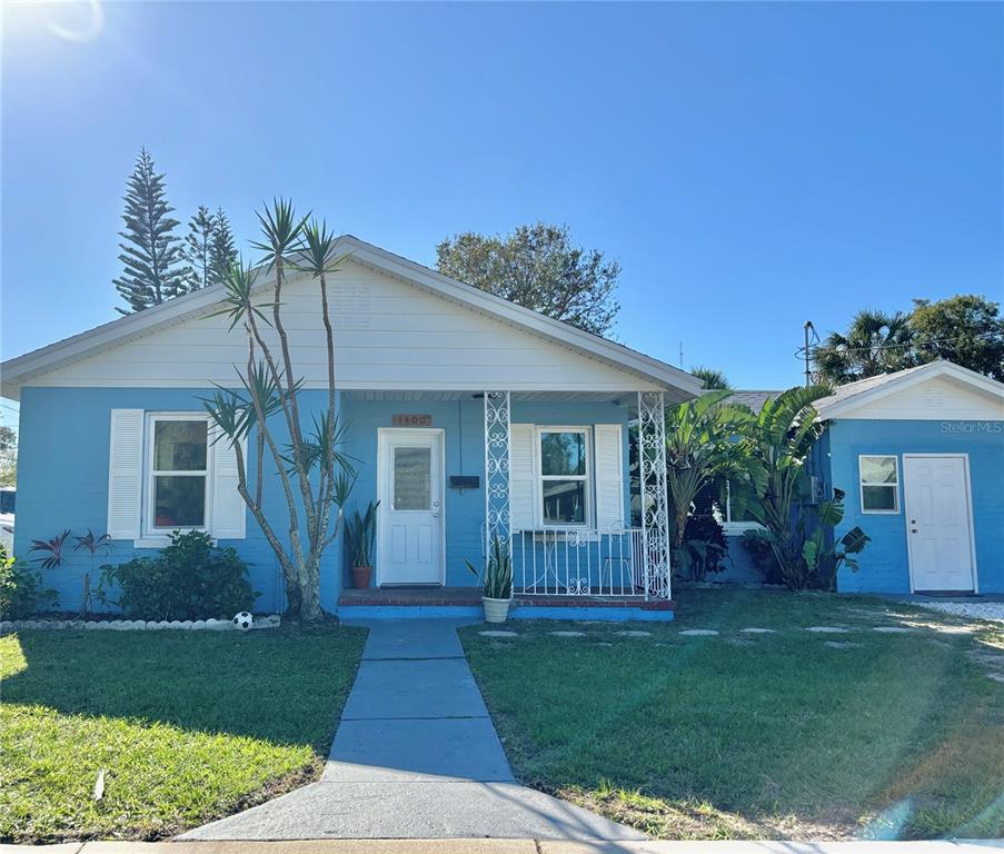 front view of a house with a yard