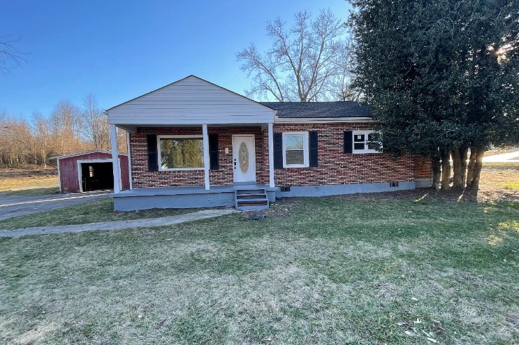 front view of a house with a yard