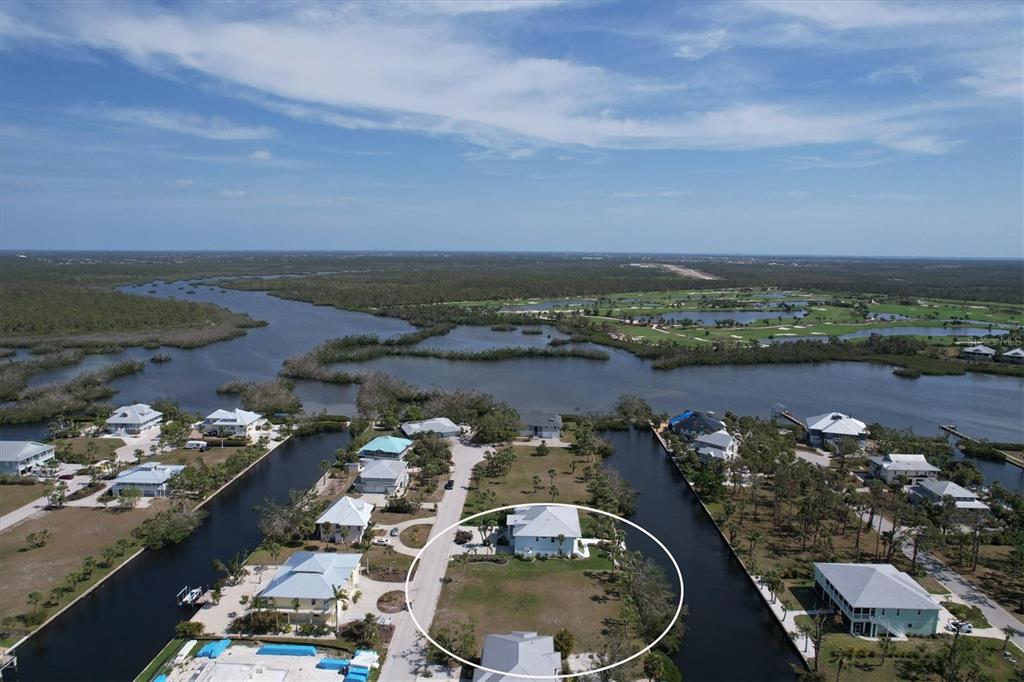 an aerial view of a house with a lake view