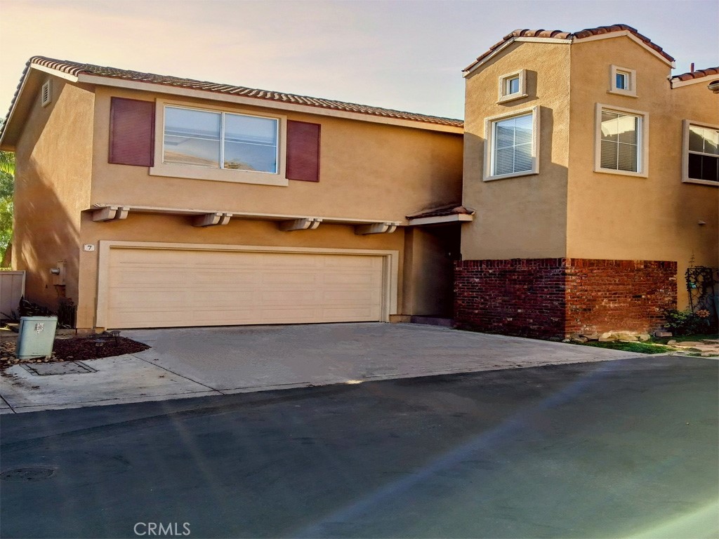 a front view of a house with a garage