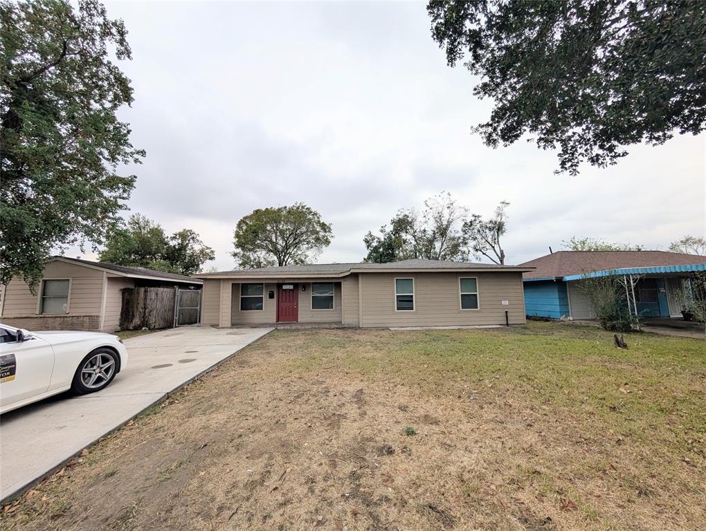 a front view of a house with yard and garage