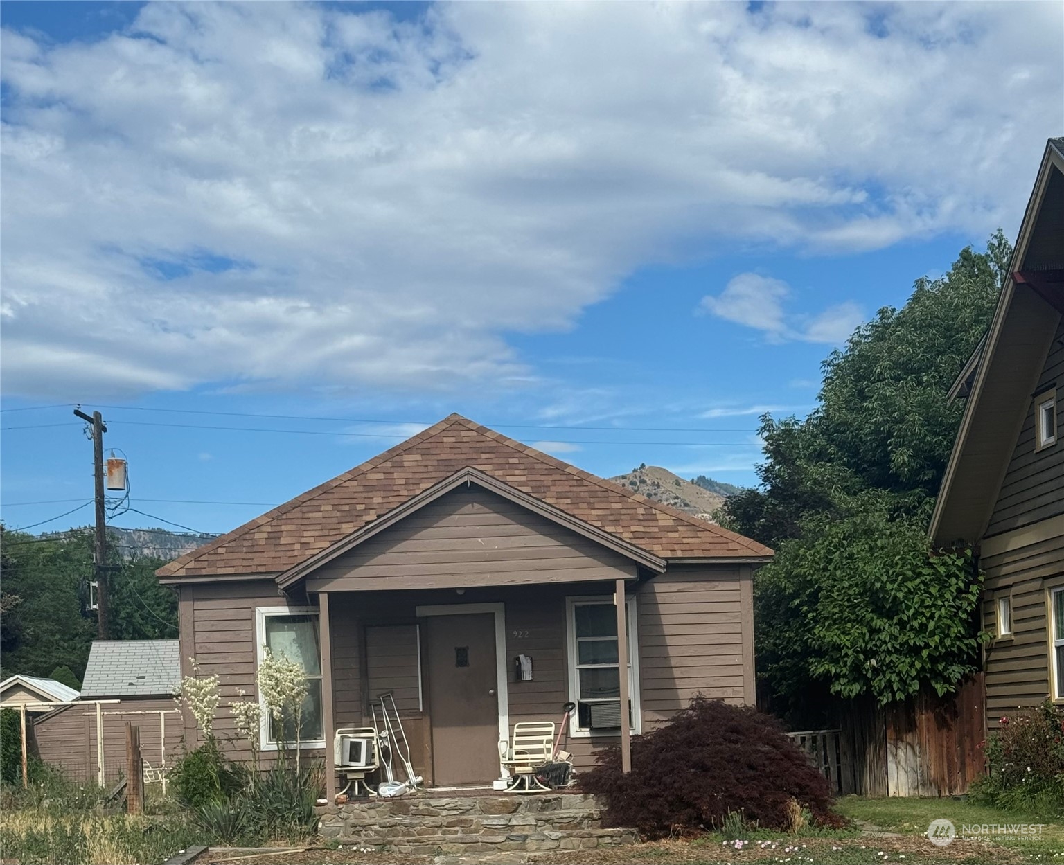 a front view of a house with garden