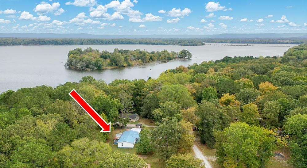 a view of a lake with a lake and houses in the back