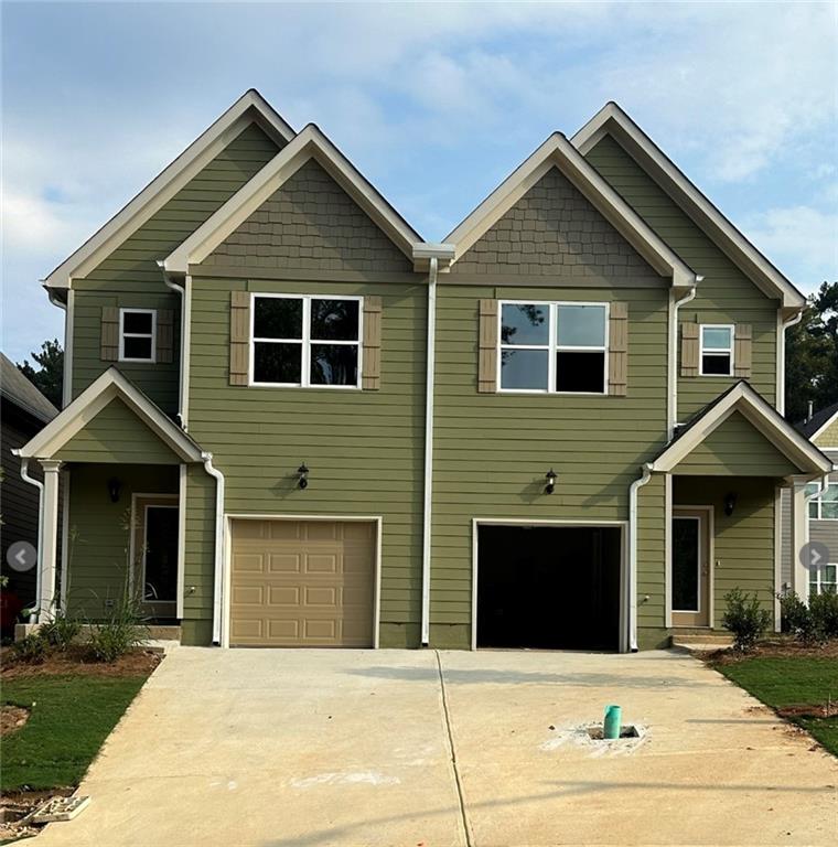 a front view of a house with yard