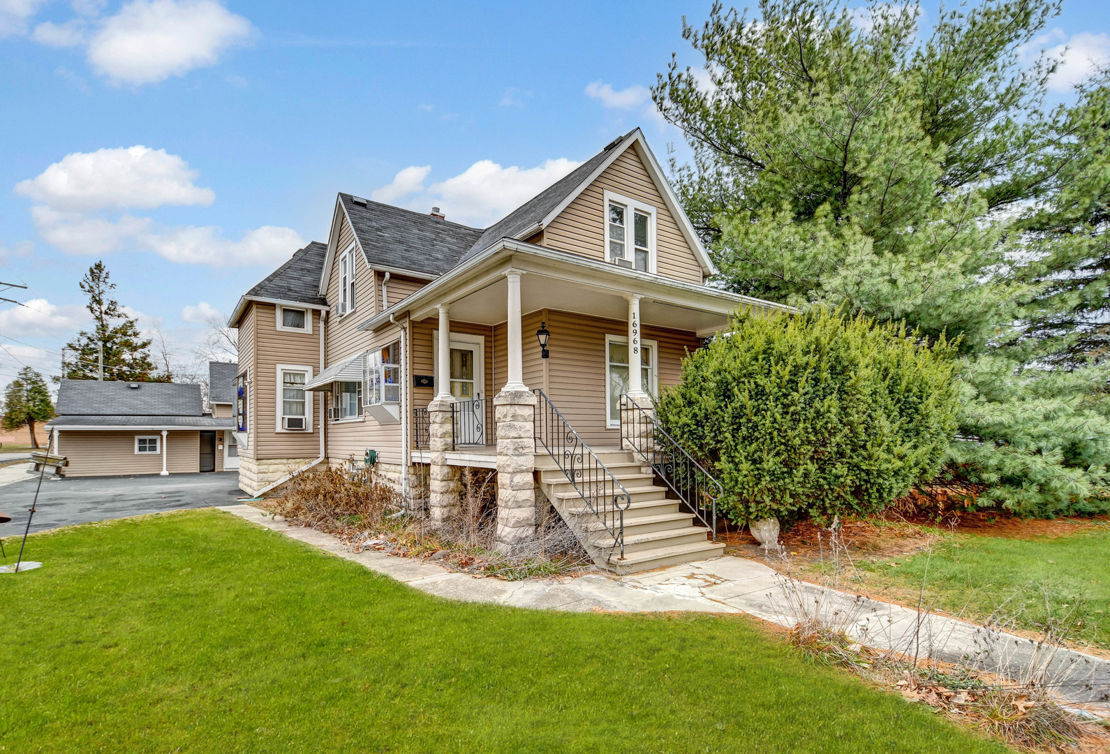 a front view of a house with a yard