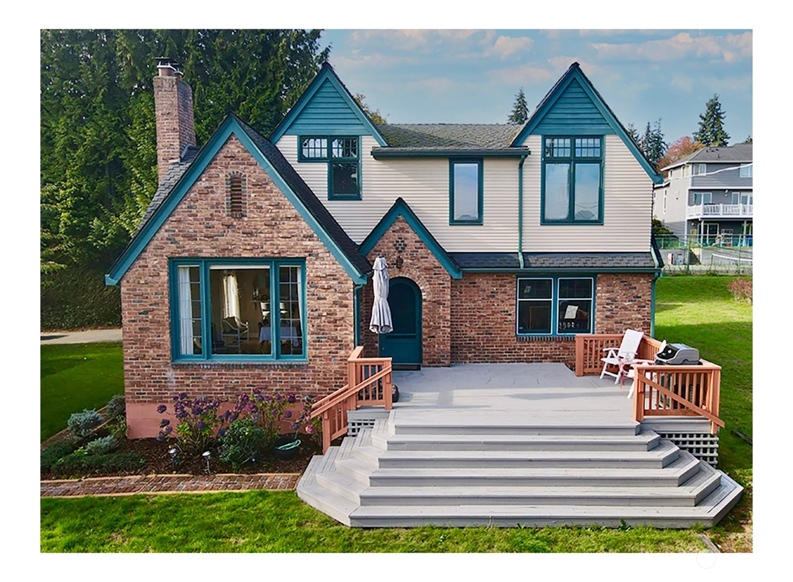 a front view of a house with garden