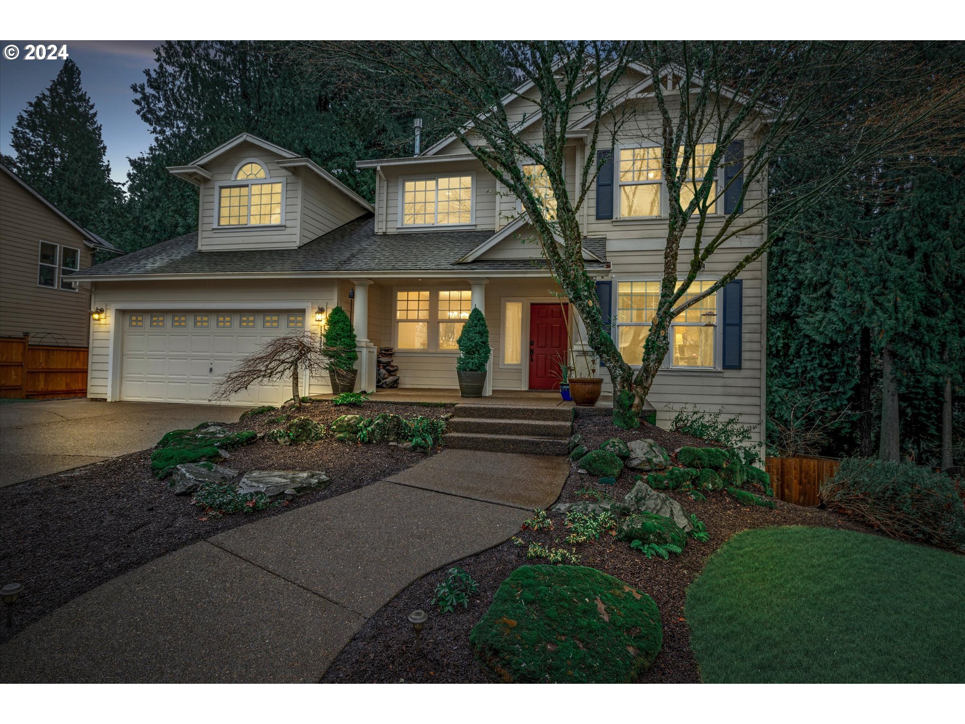 a front view of a house with garden