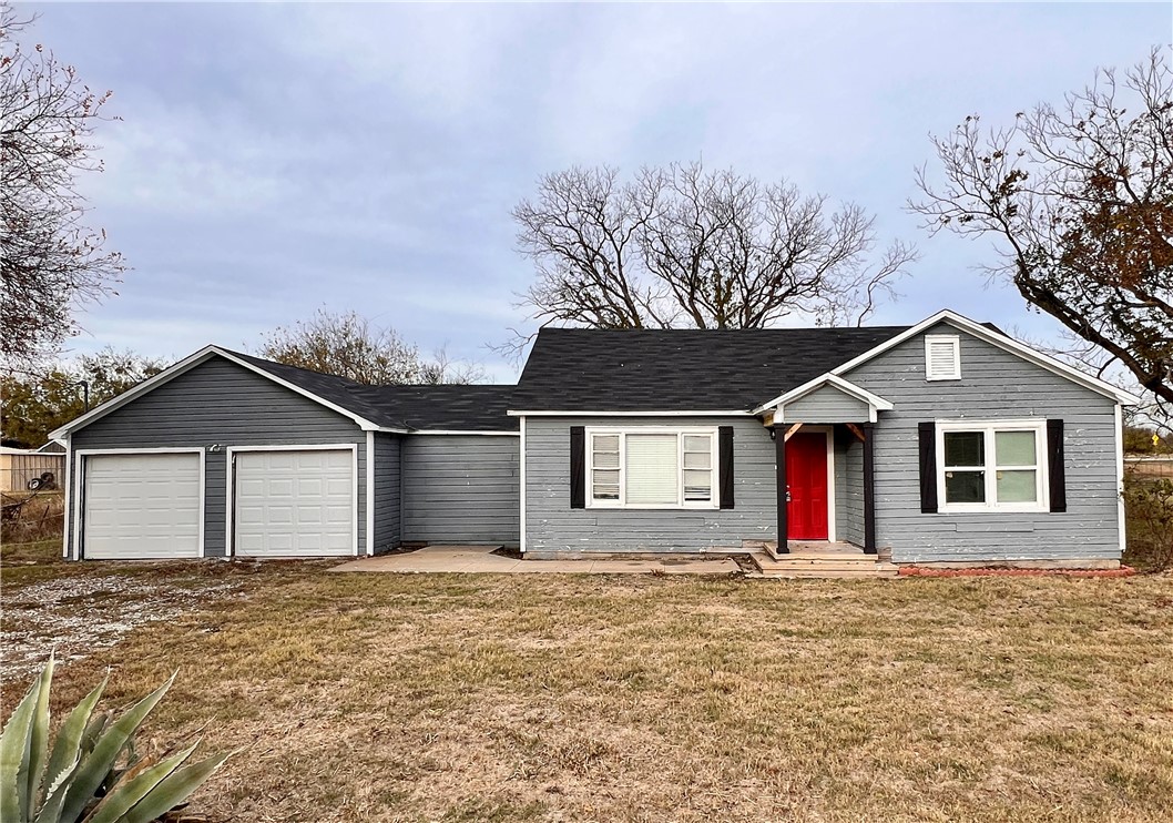 front view of house with a yard