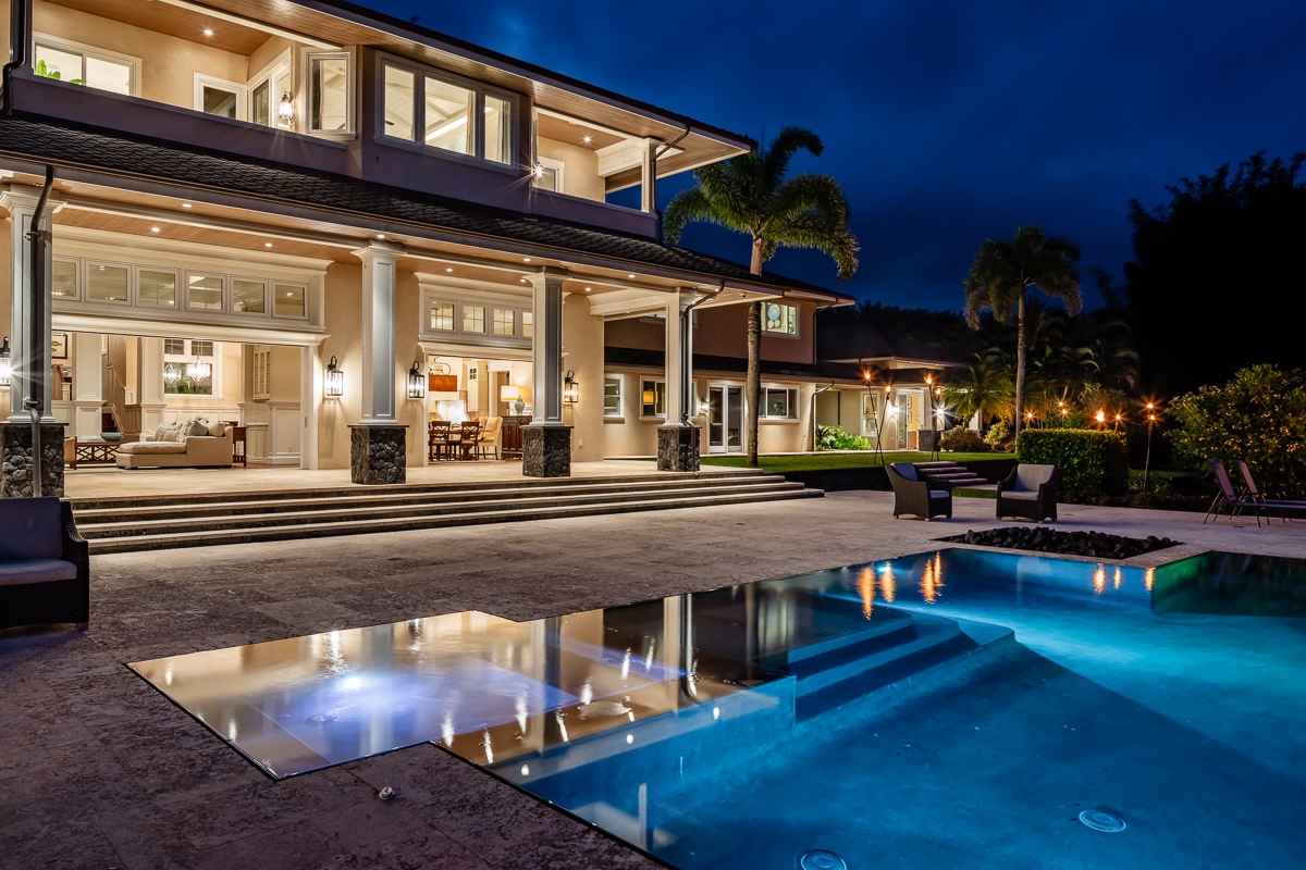 a swimming pool view with a outdoor seating