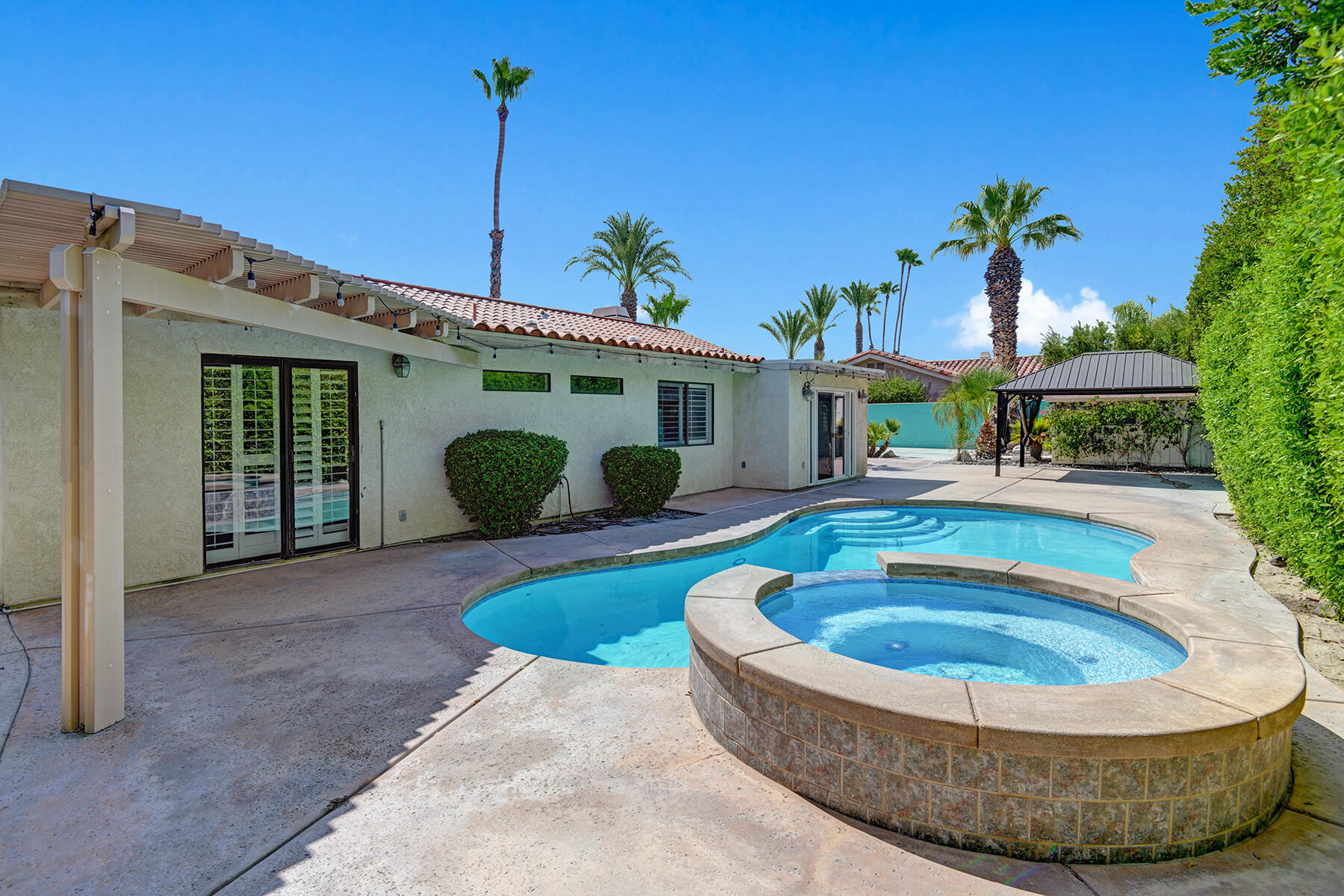 a view of a house with swimming pool