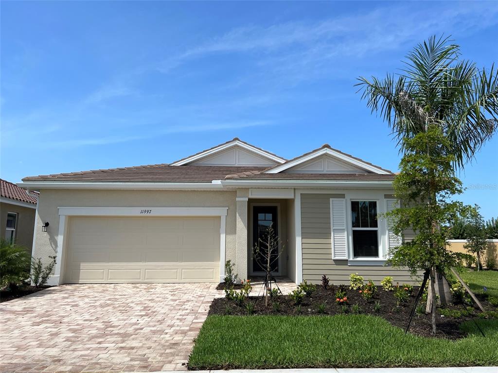 front view of a house with a yard