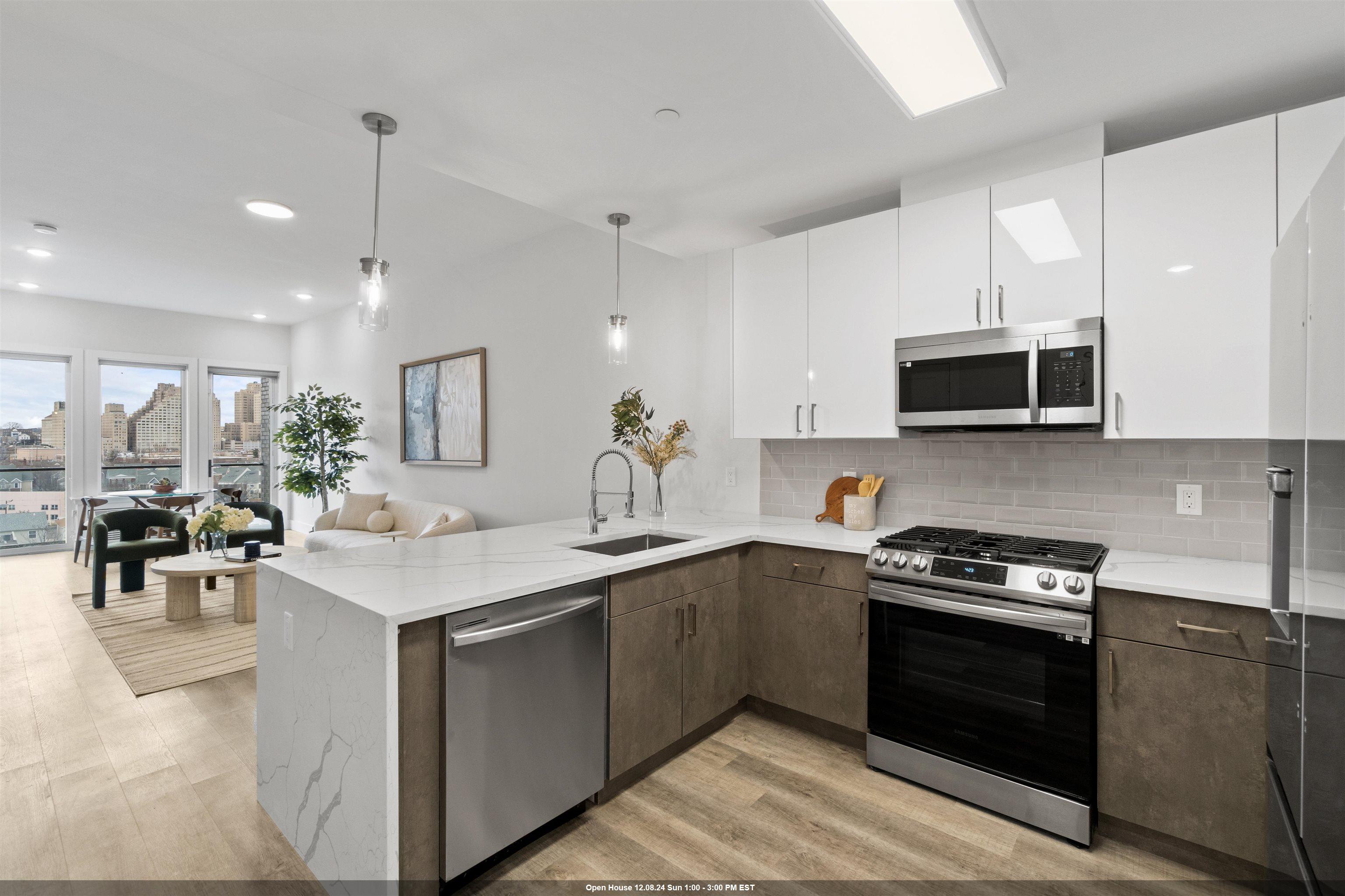 a kitchen with a sink stove and microwave