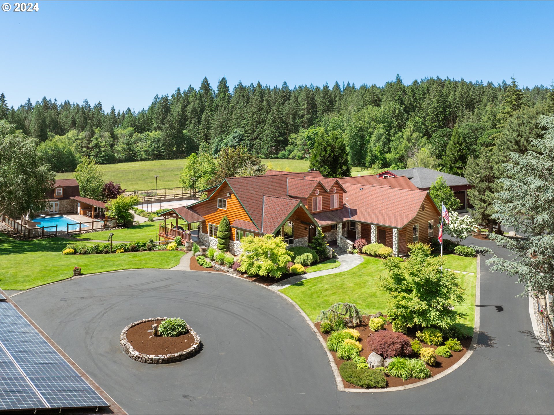 an aerial view of a house with outdoor space