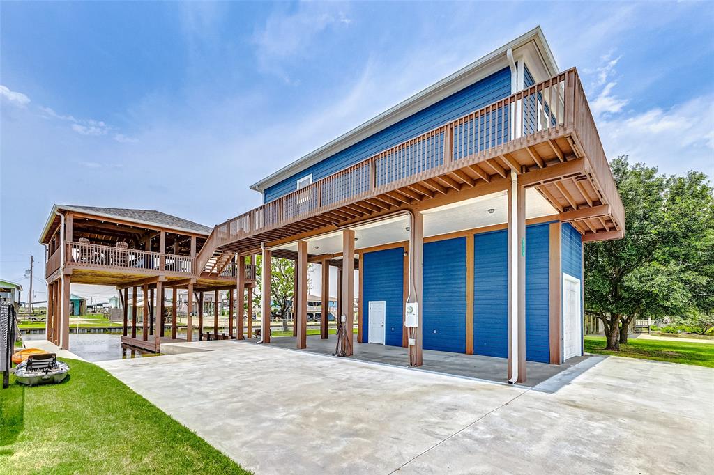 a view of a house with a backyard and porch