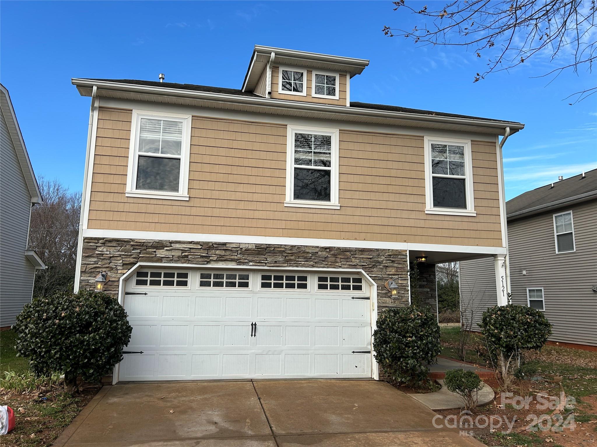 a front view of a house with yard