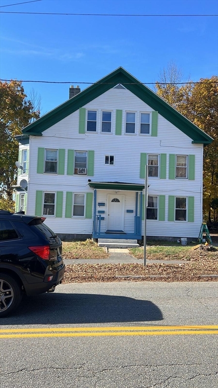 a front view of a house with swimming pool