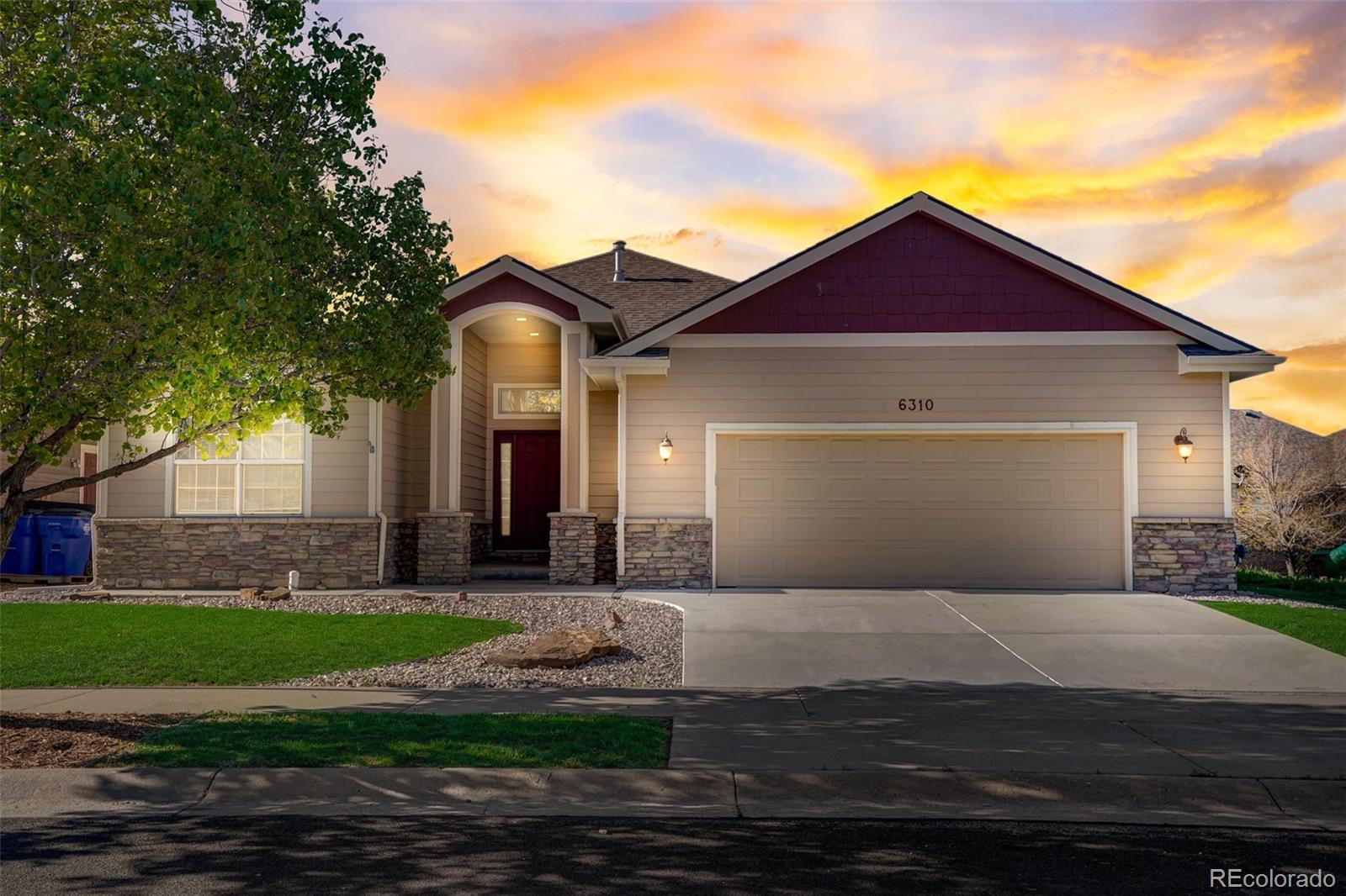 a front view of a house with yard