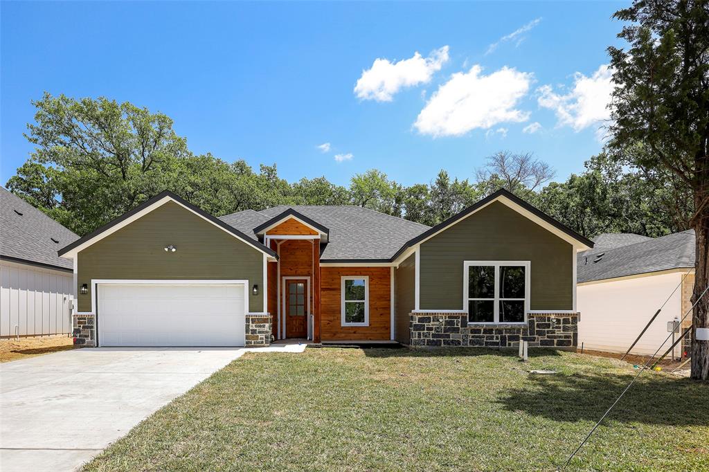 front view of a house with a yard