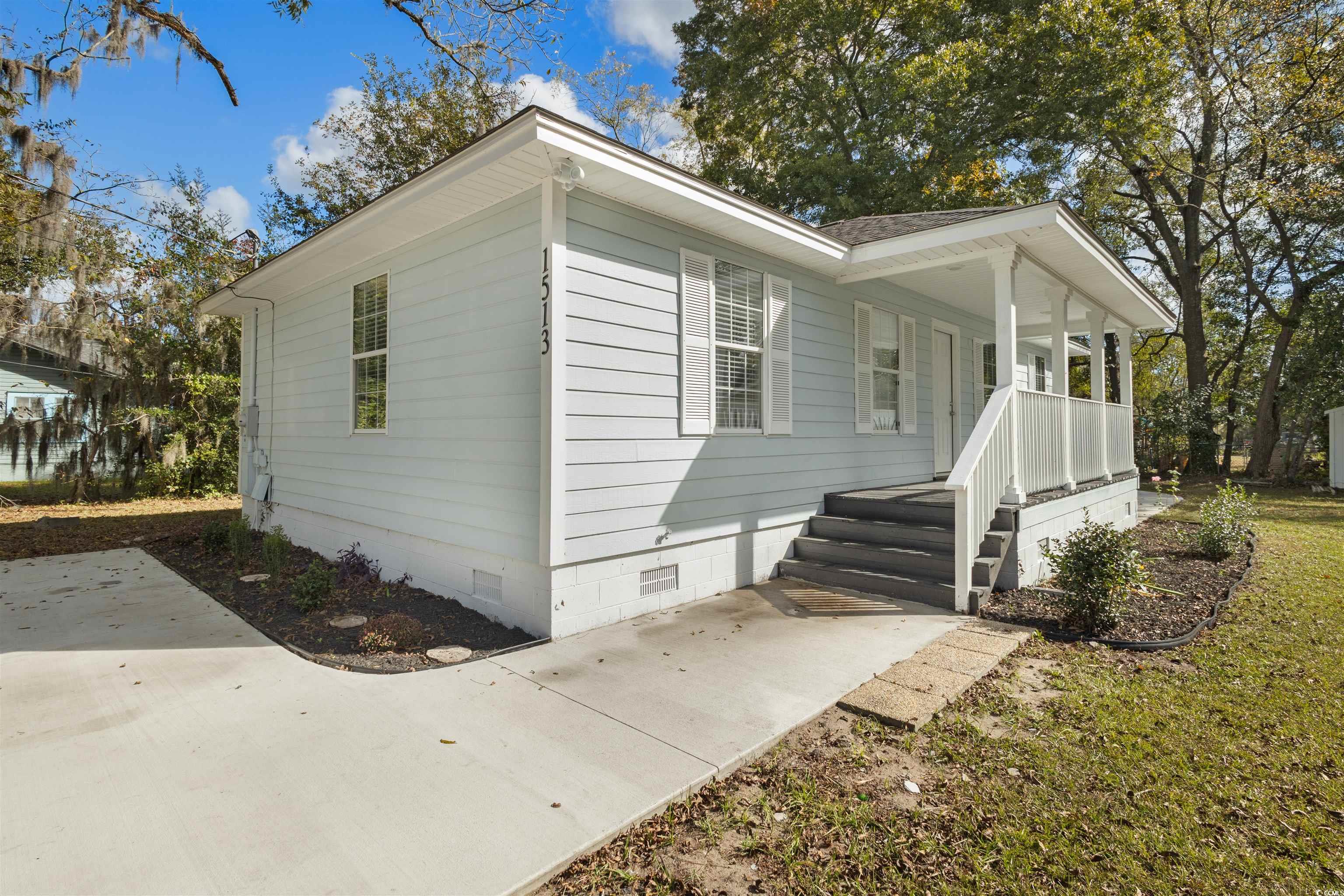 View of home's exterior featuring a porch