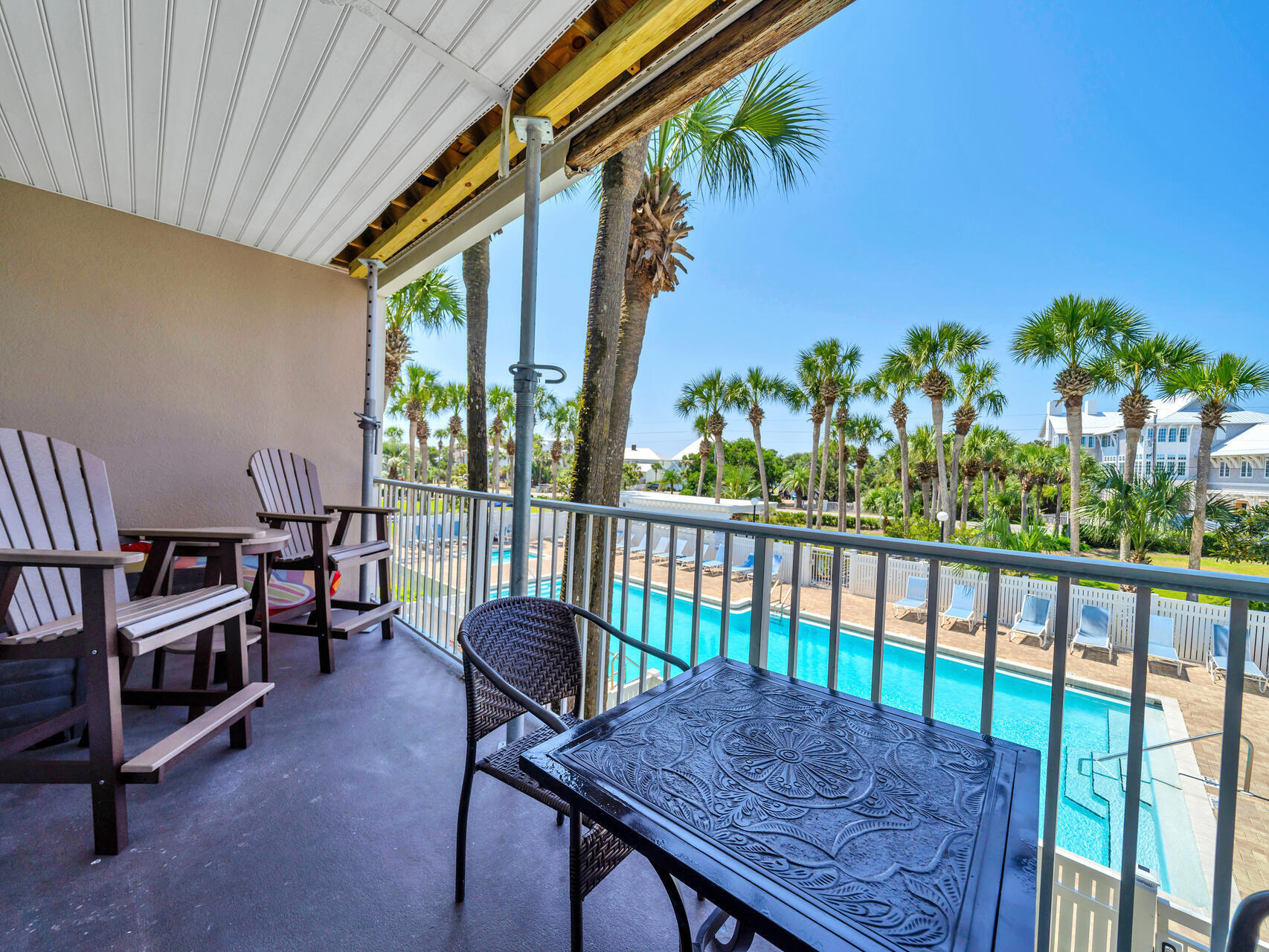 a view of a balcony with furniture