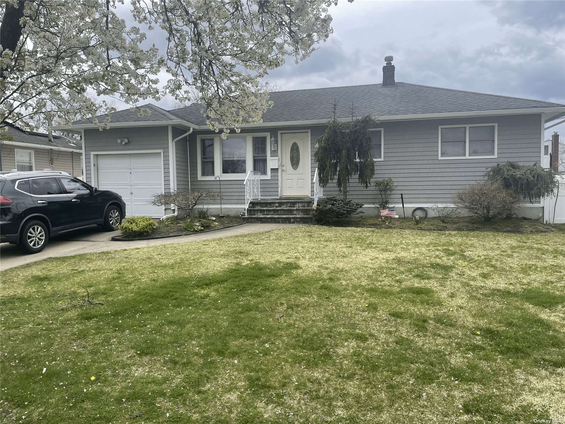 a house view with a garden space