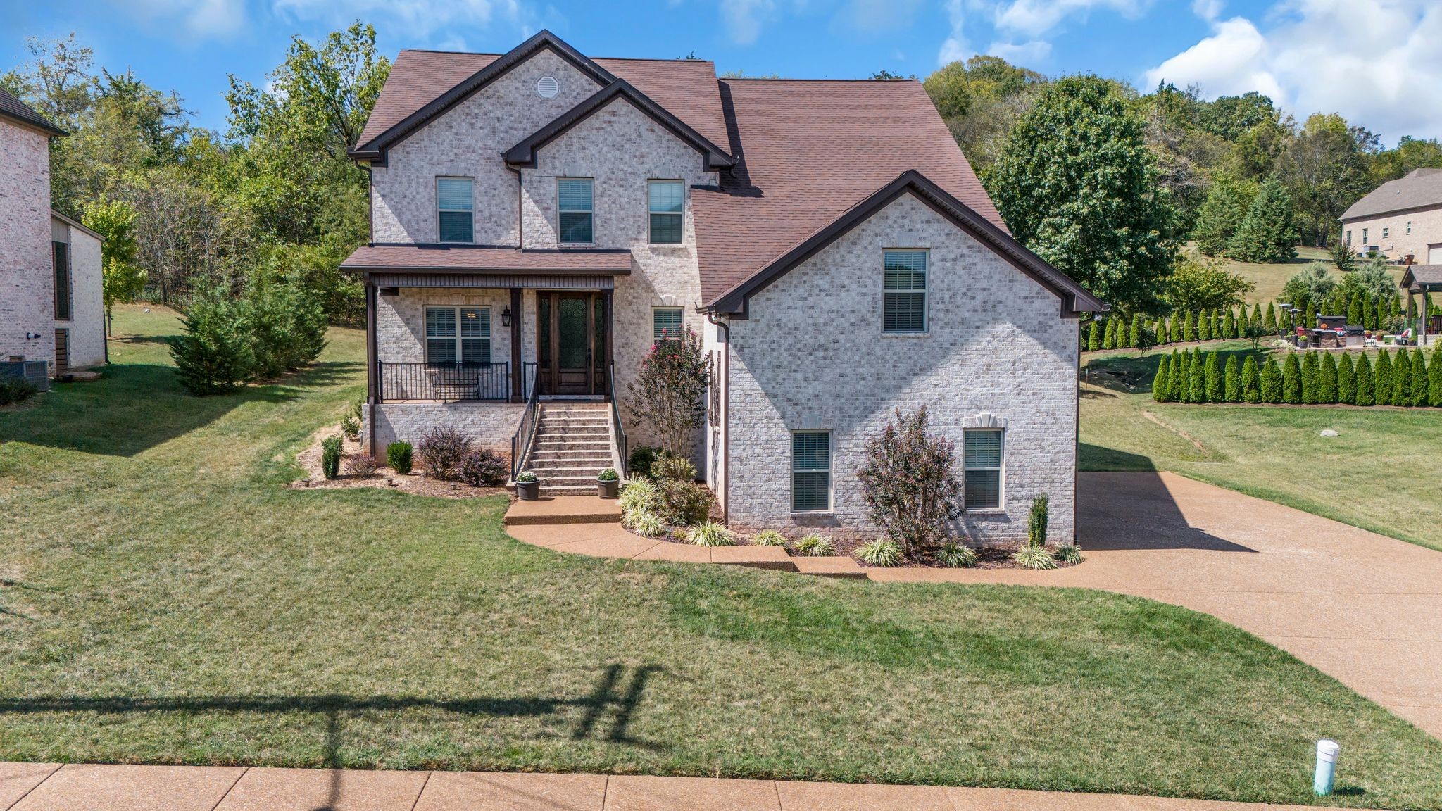 front view of a house with a yard