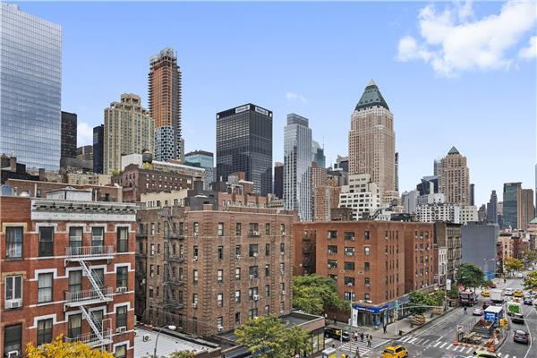 a view of city with tall buildings