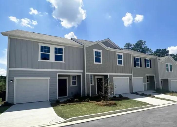 a front view of a house with yard