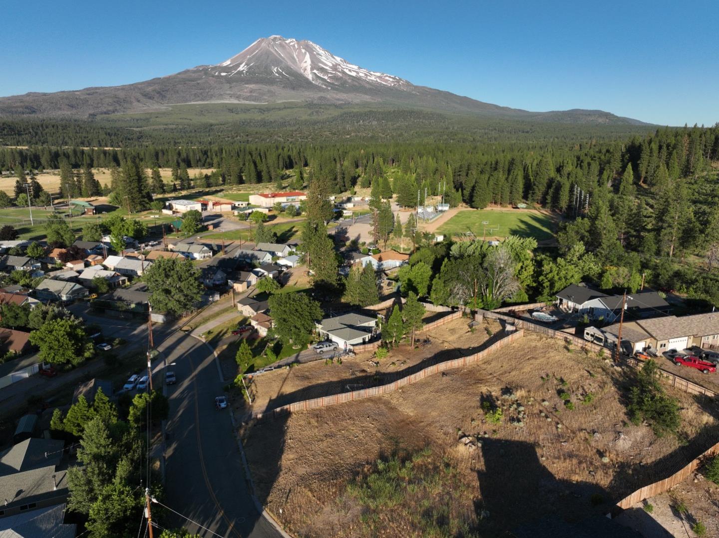 a view of a town with mountains in the background