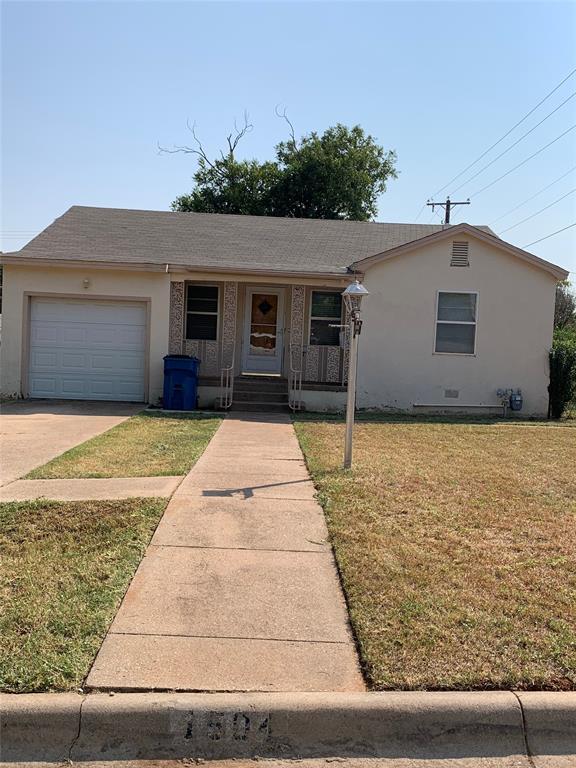 a house with yard in front of it