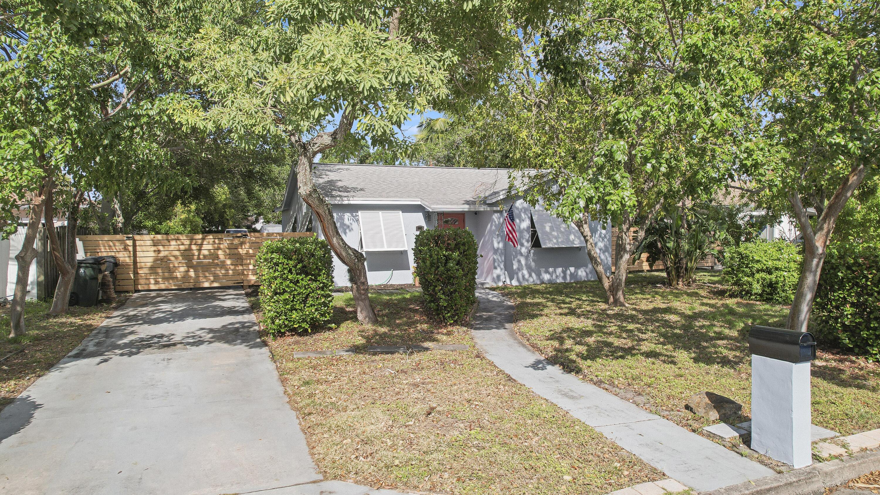 front view of a house with a trees