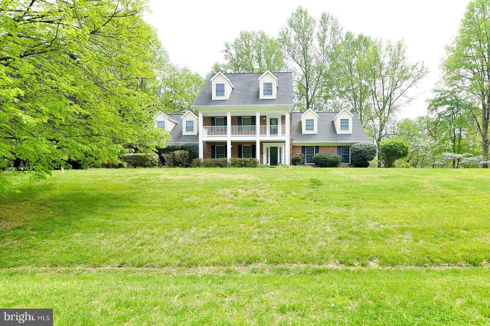 a view of a big yard with a building in the background