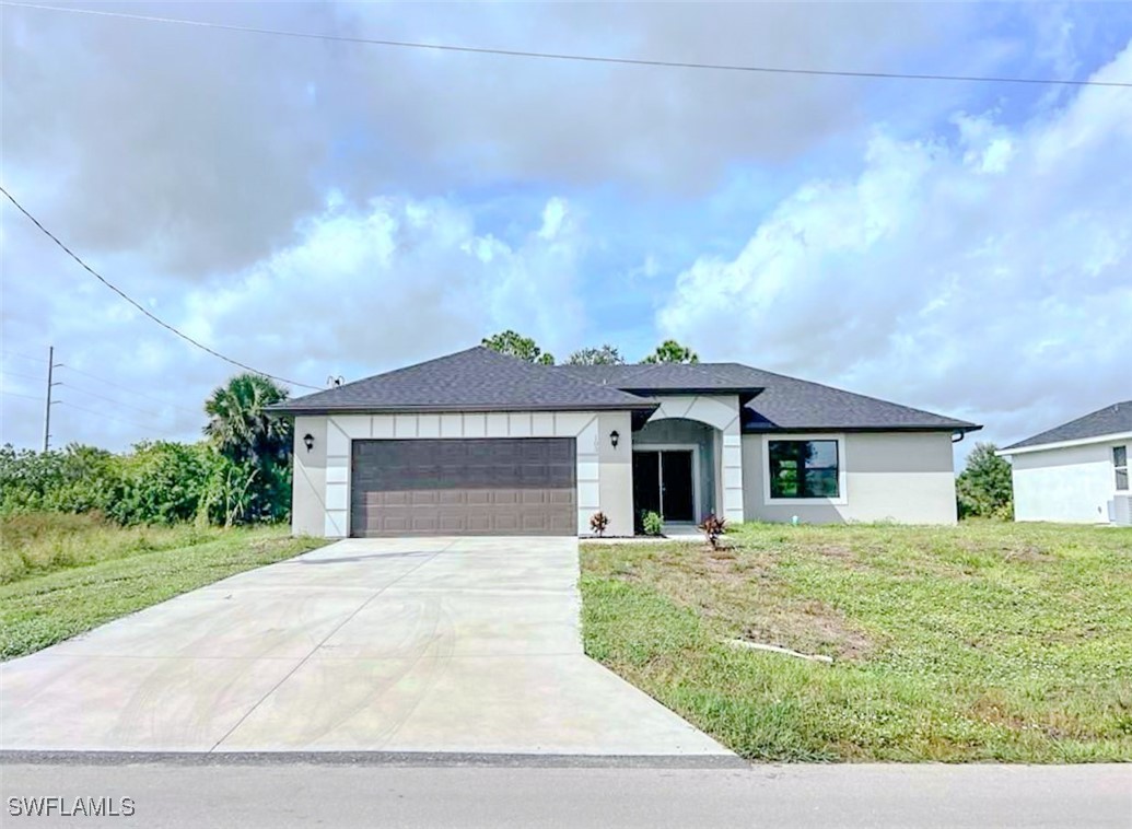 a front view of a house with yard