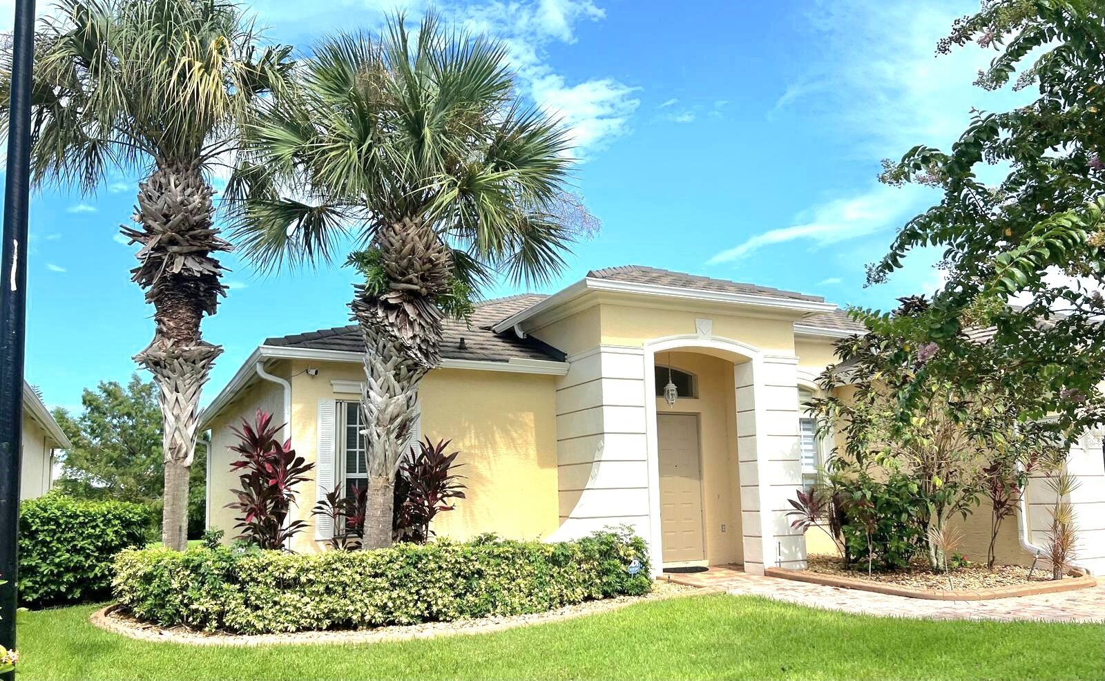 front view of a house with a yard