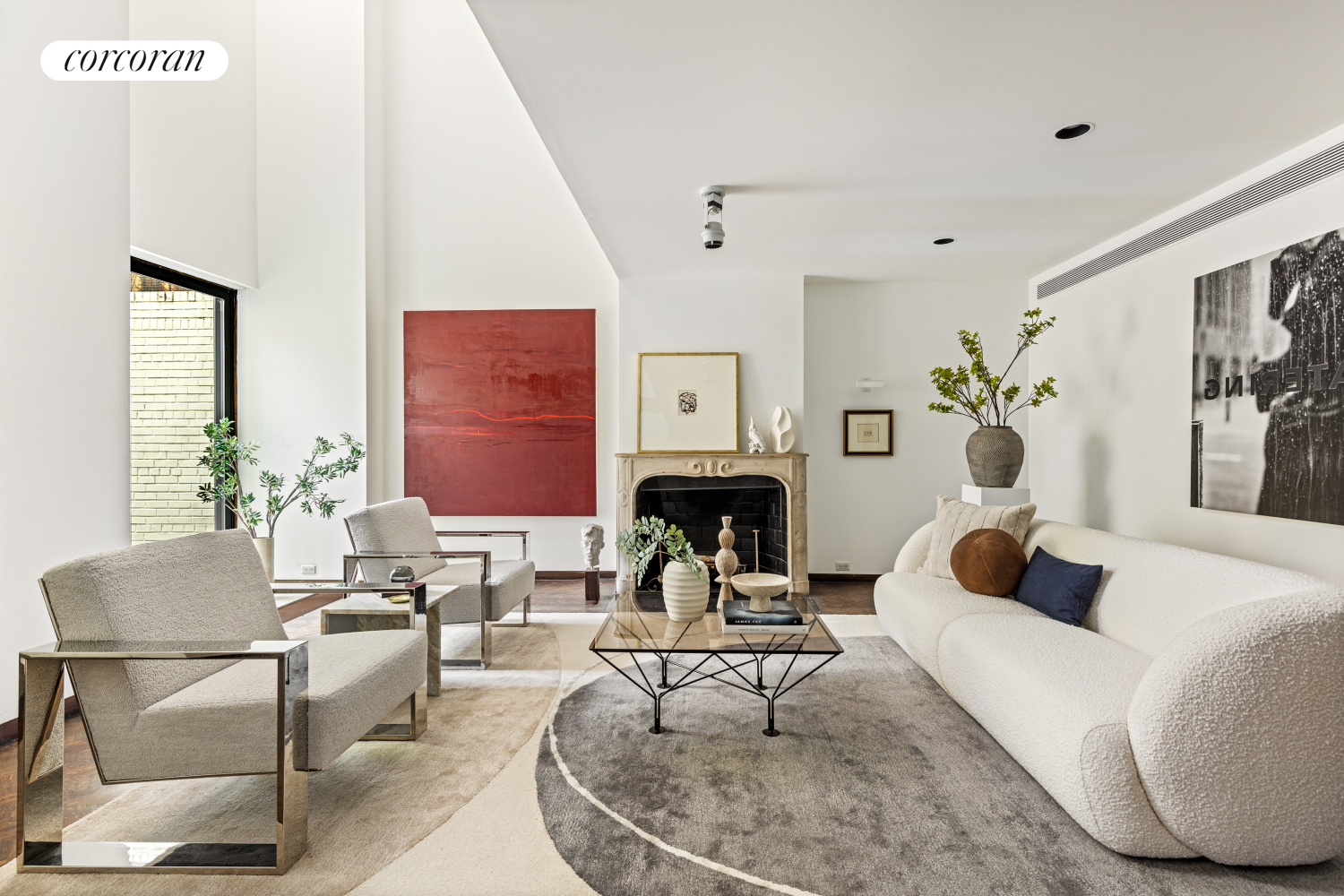 a living room with furniture and a fireplace