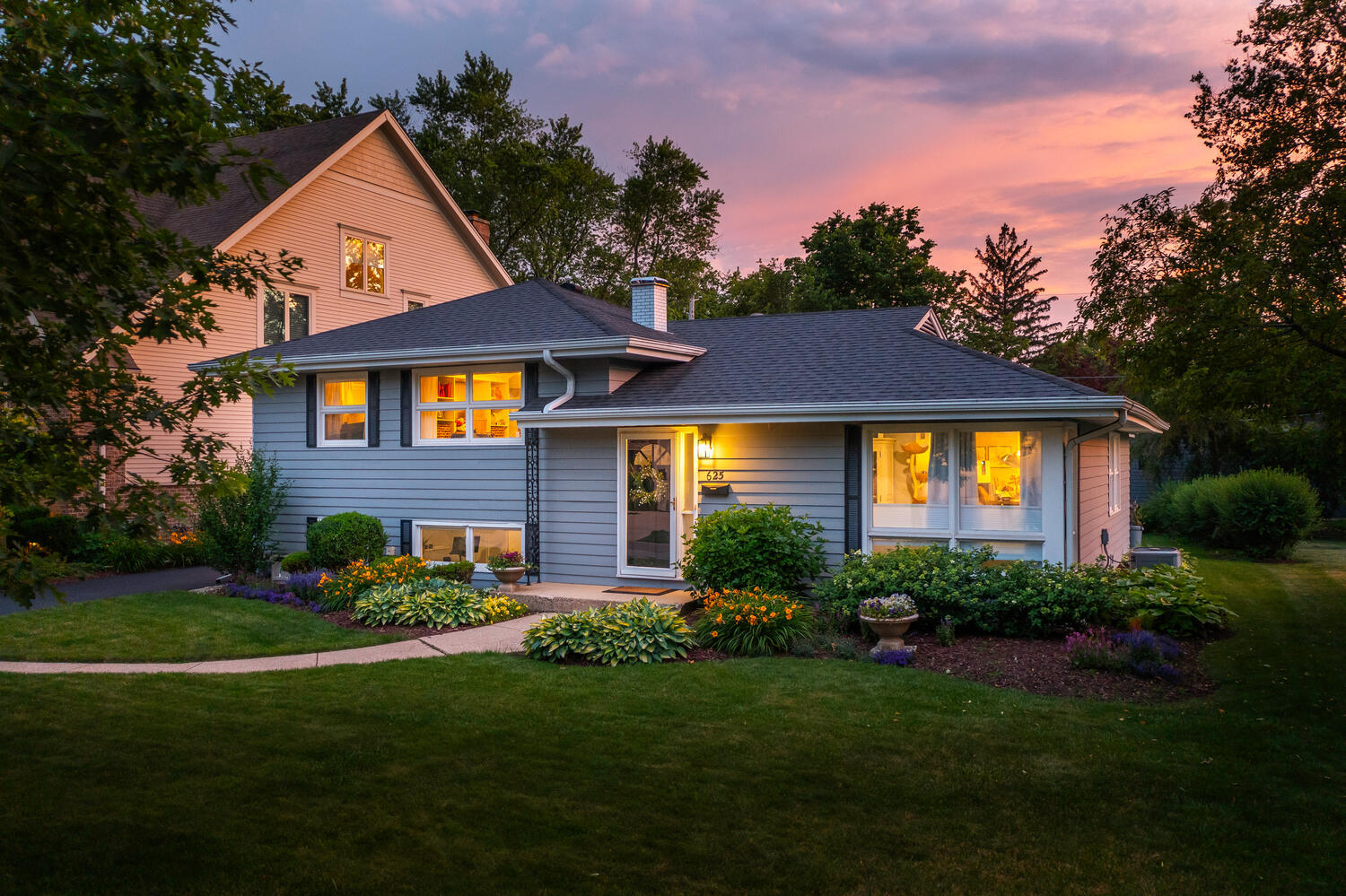 a front view of a house with a yard