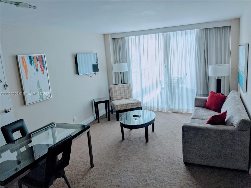 a living room with furniture and a window