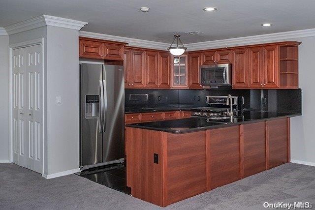 a kitchen with stainless steel appliances granite countertop a refrigerator a sink and a stove