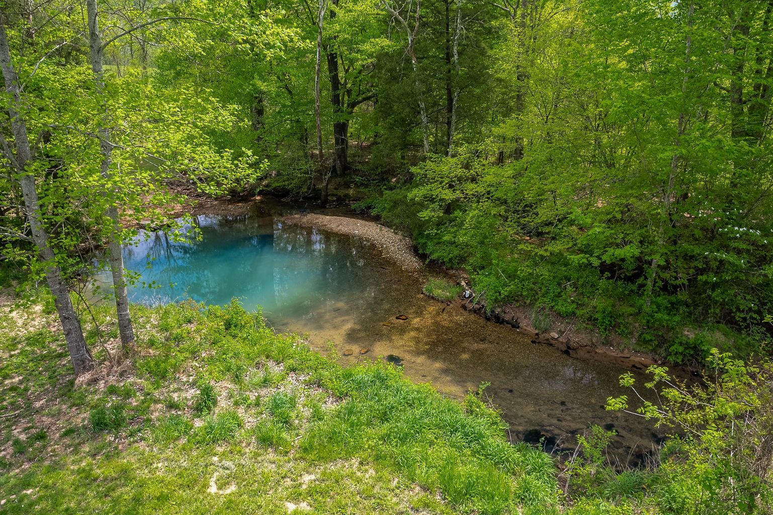 a view of a lake with a yard