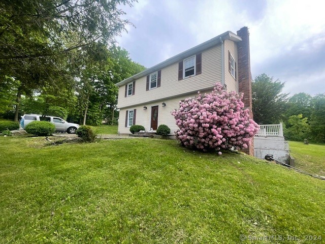 a front view of a house with garden