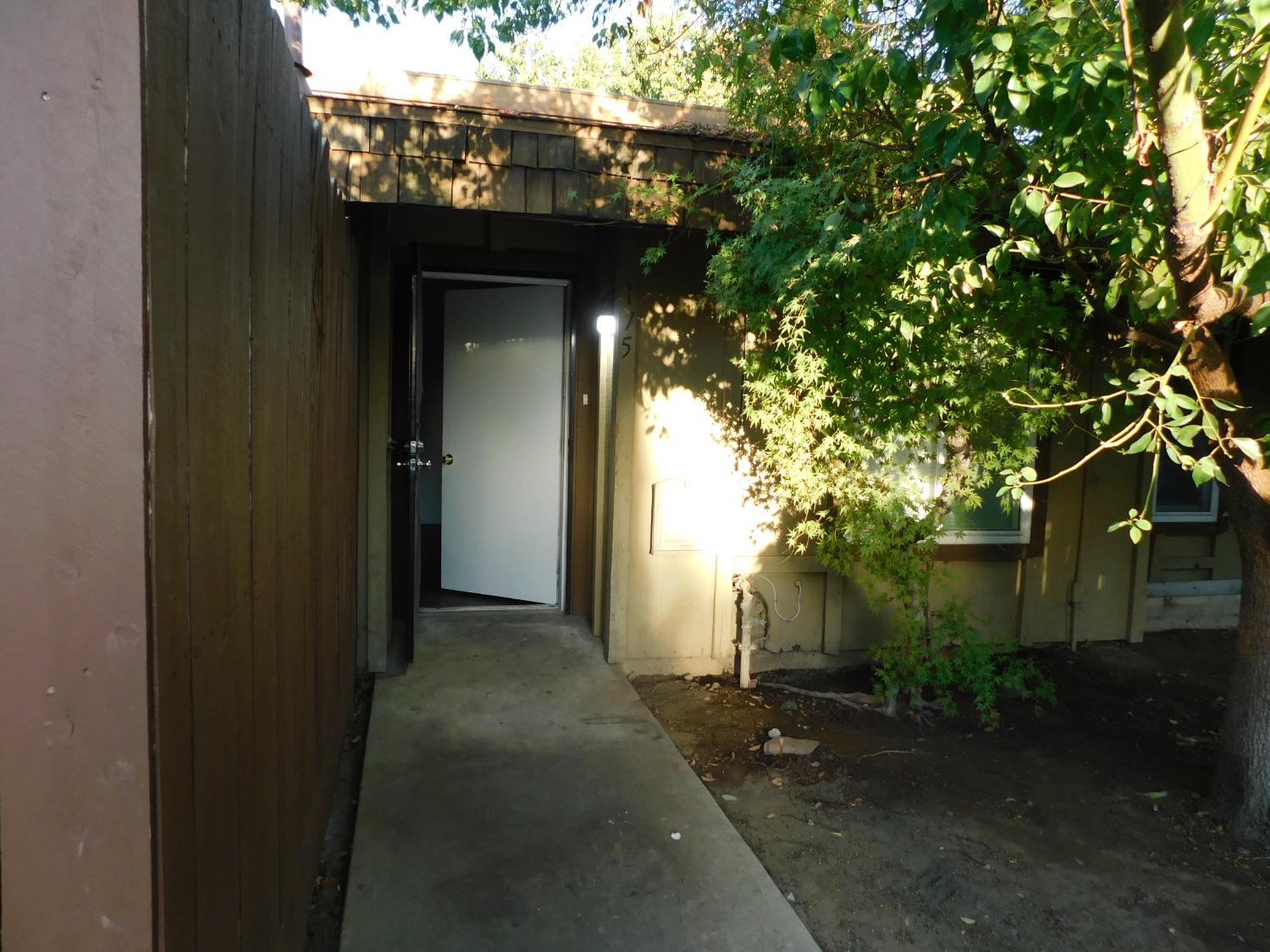 a view of a house with a tree