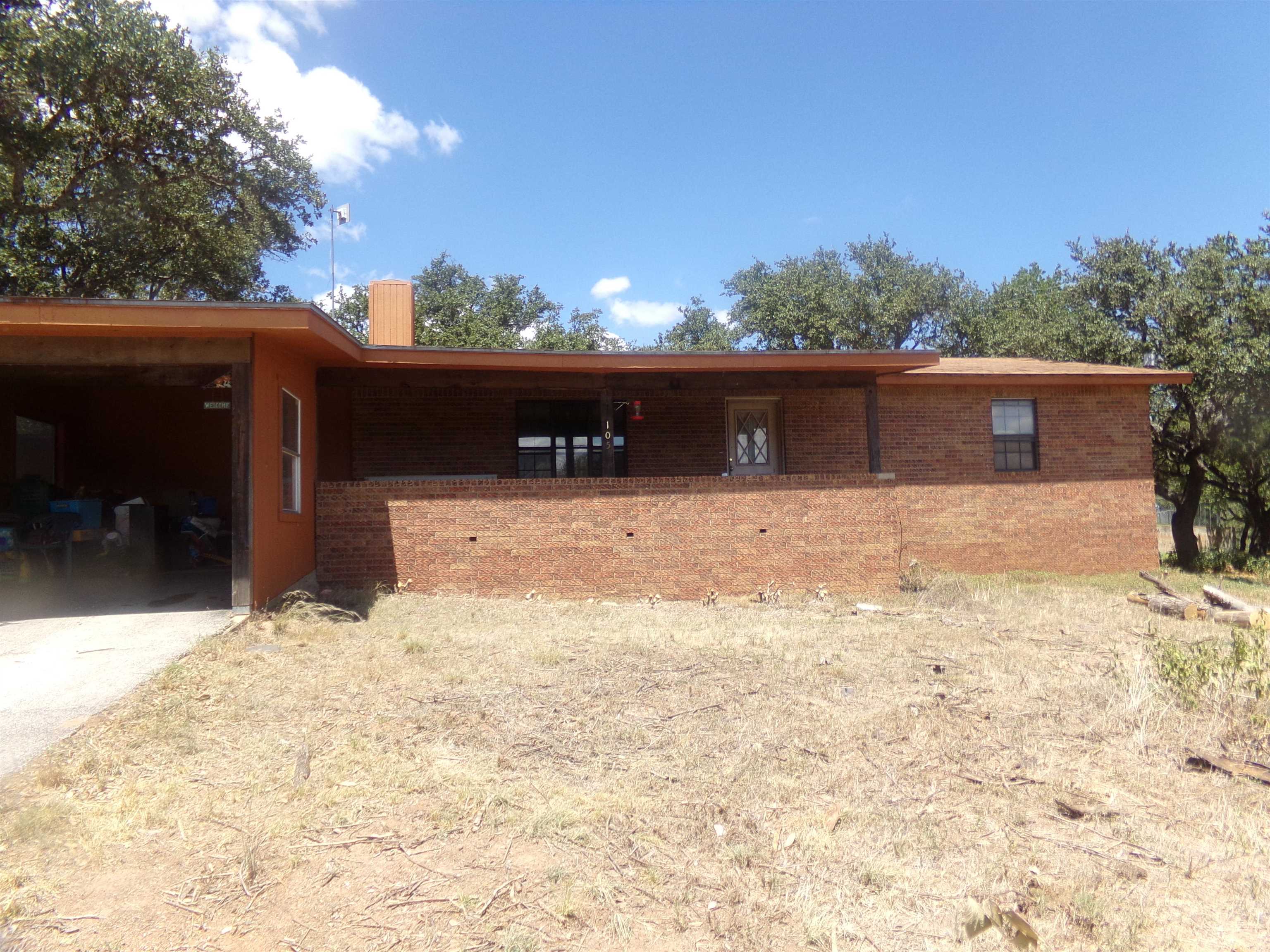 a view of a backyard of the house