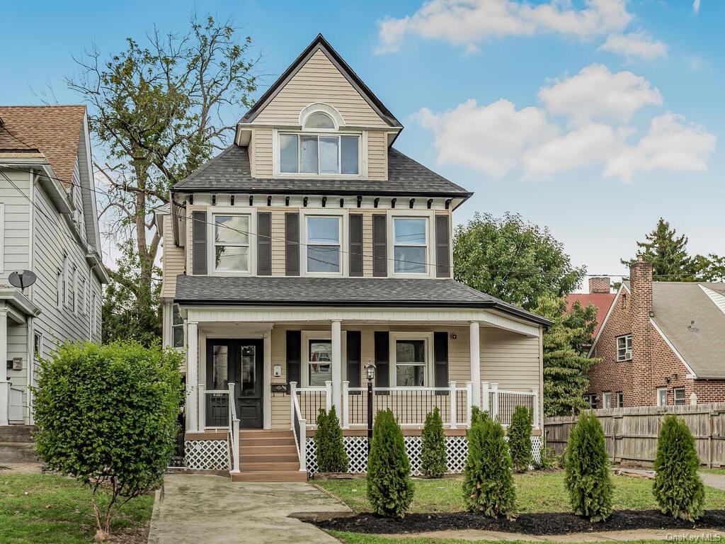 View of front of house with covered porch