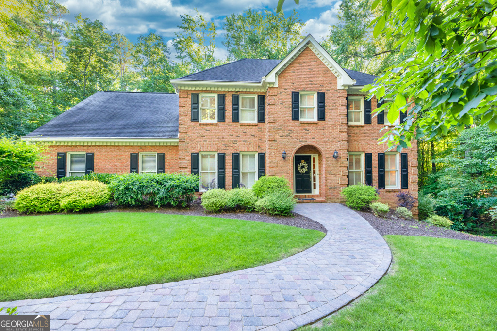 Classic four-sided brick home on a FULL BASEMENT within a CUL-DE-SAC, is the largest lot in the community as it provides nearly 2.5 ACRES!