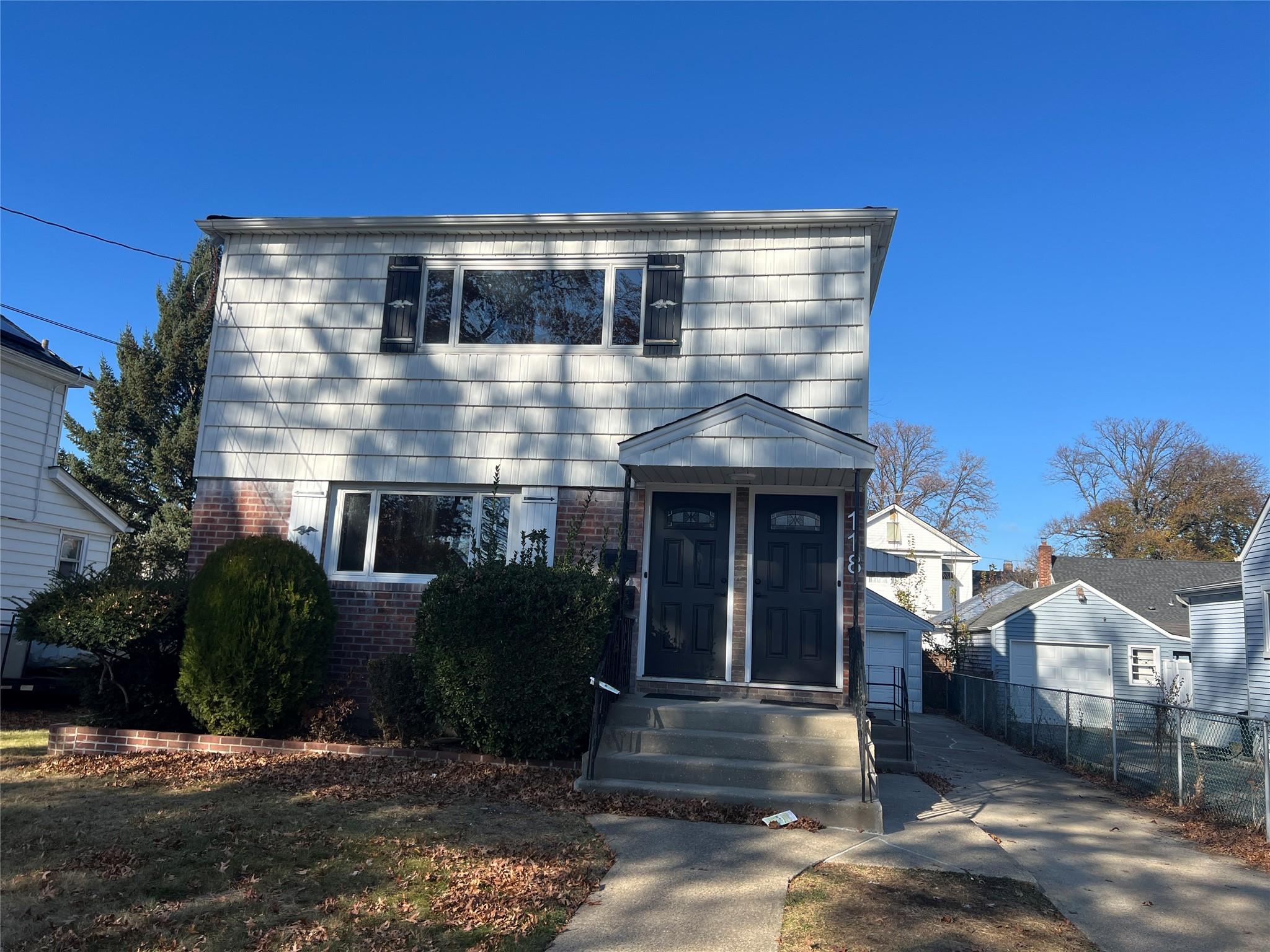 a front view of a house with yard