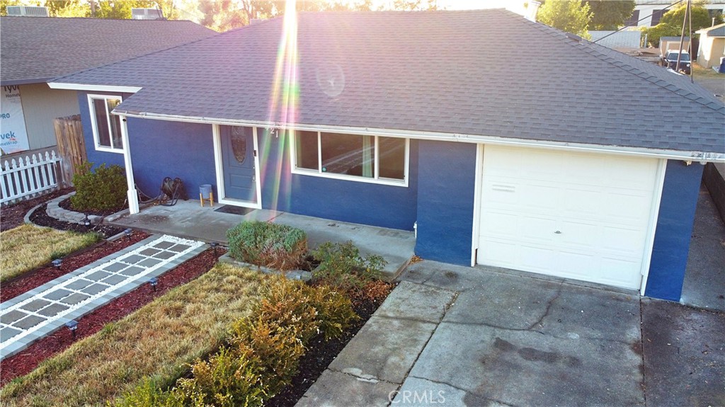 a front view of a house with garden