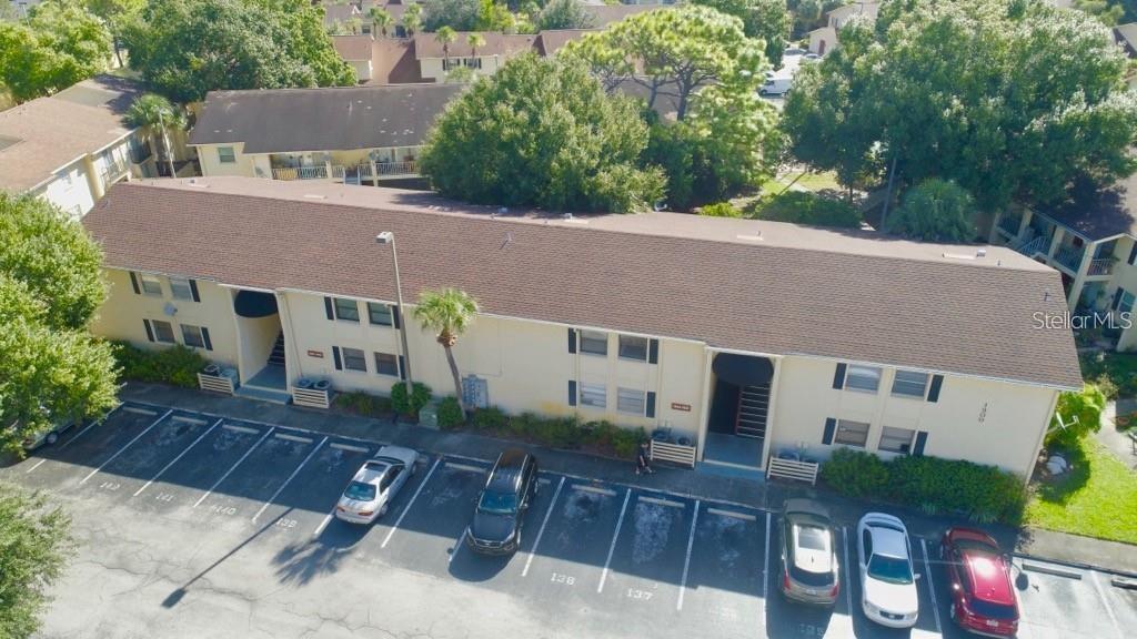 an aerial view of a house with table and chairs