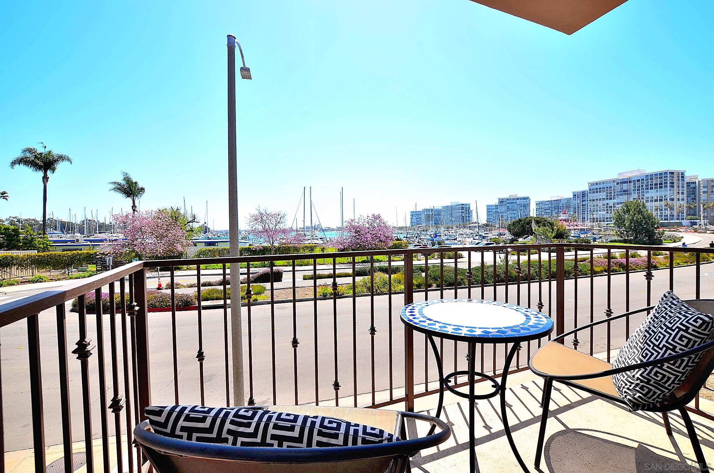 a view of a balcony with lake view and wooden floor