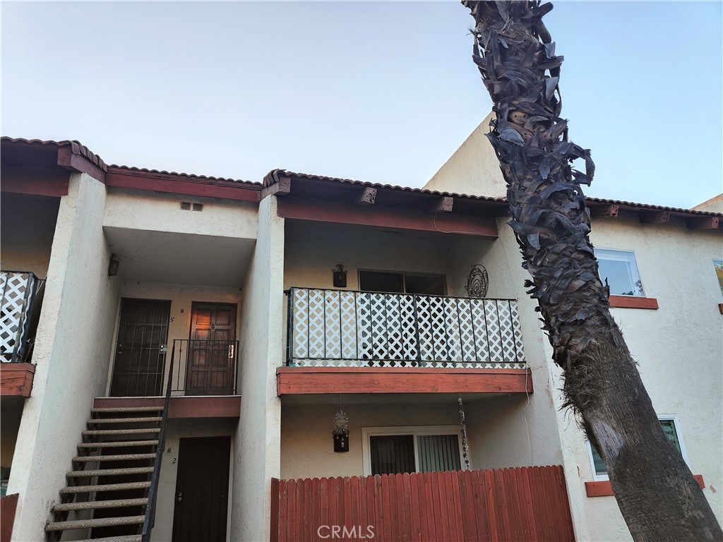 a view of a house with wooden deck